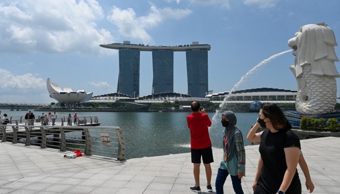 Singapore to lift travel curbs, in ‘major milestone' to live with the virus